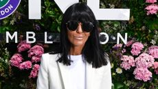 Image of Claudia Winkleman at Wimbledon 2026 with black bob and fringe, wearing sunglasses and a cream blazer