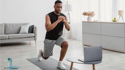 Man doing a lunge at home