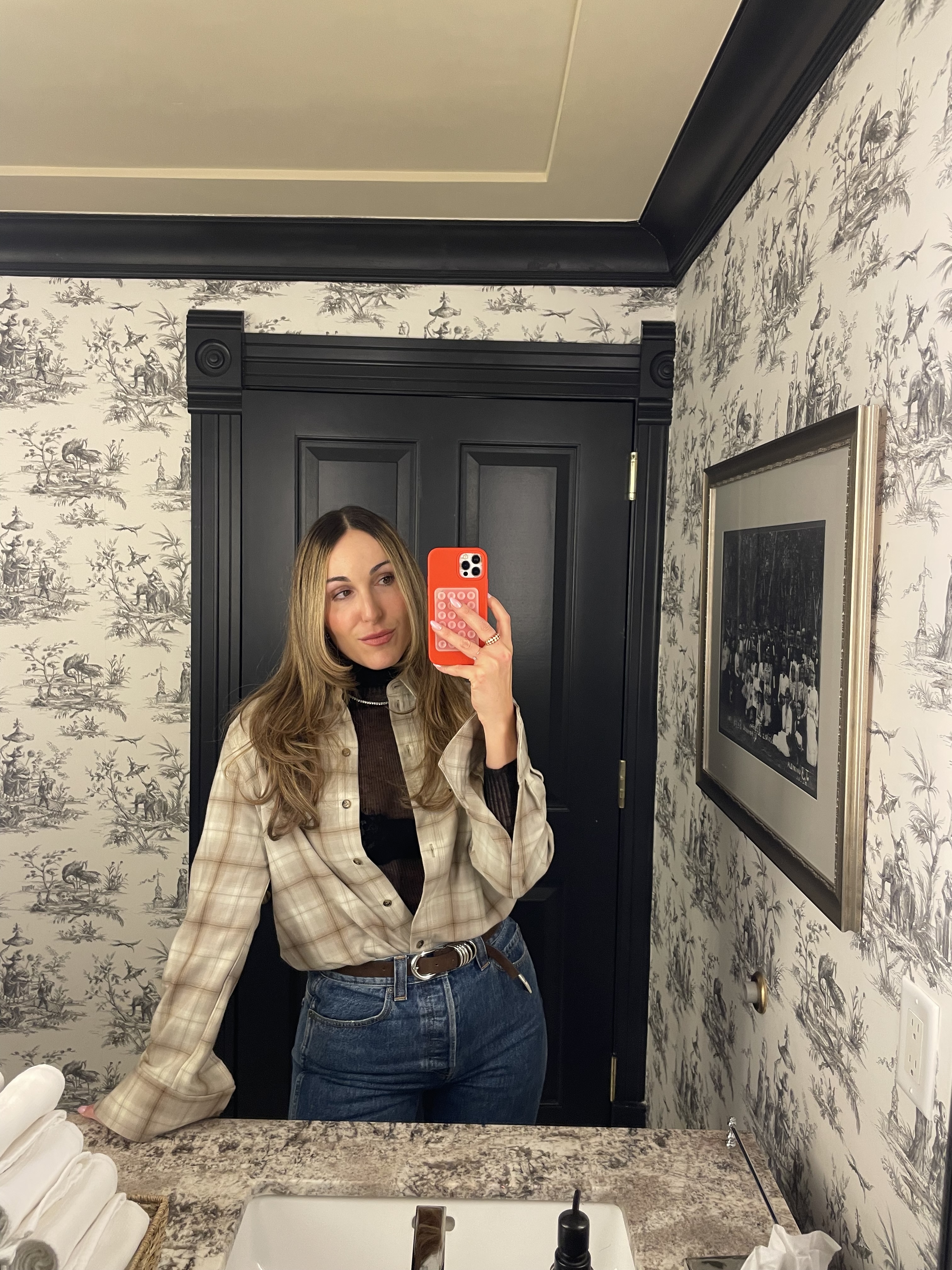 Anna LaPlaca wearing a COS plaid shirt with Khaite jeans in Aspen.