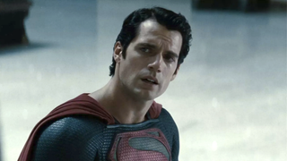 Henry Cavill speaking as he stands in the train station in Man of Steel
