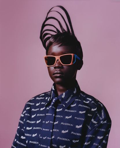 Female model wears JW Anderson x Persol 0009 sunglasses