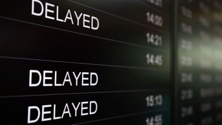 A digital flight board is showing delayed arrival flights at Sofia Airport in Sofia, Bulgaria