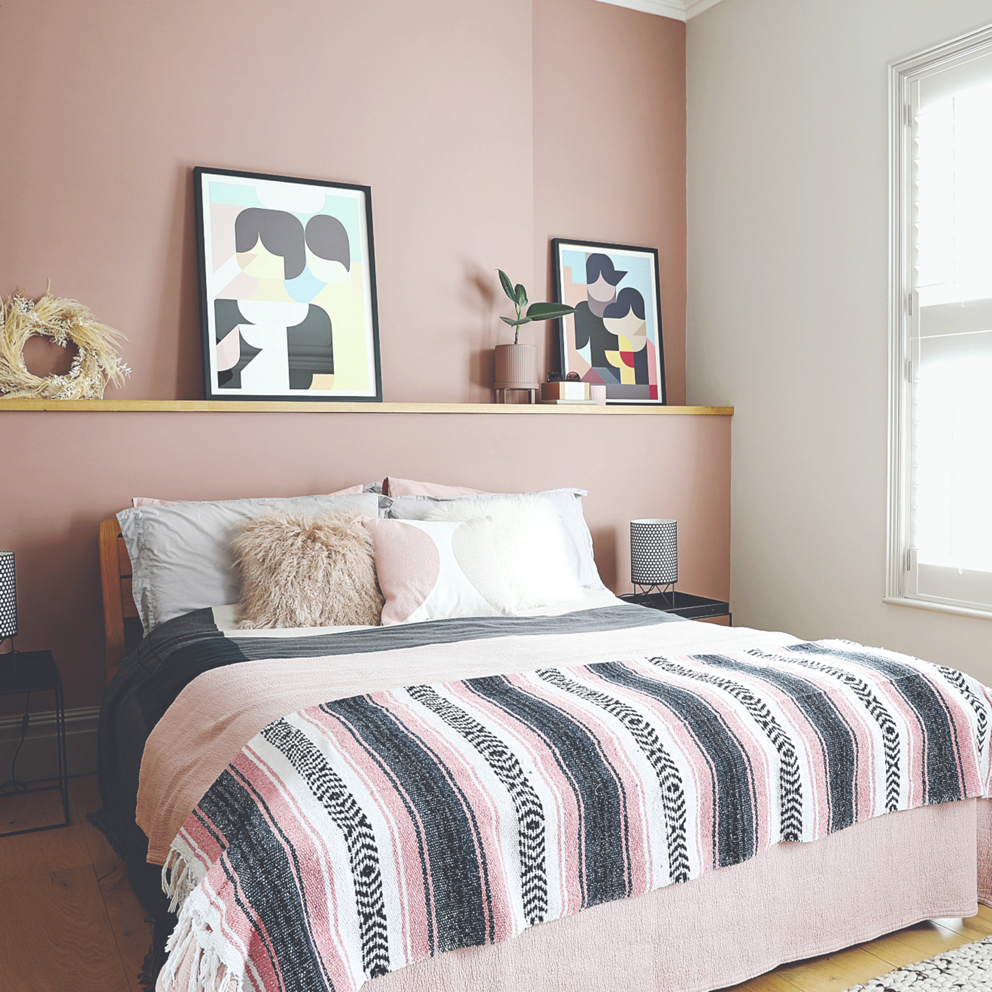 Small bedroom with pink walls