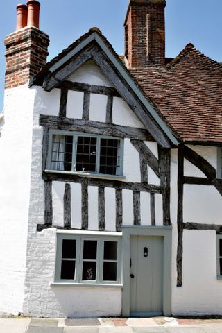 A well-maintained timber-frame house has moved and settled with age