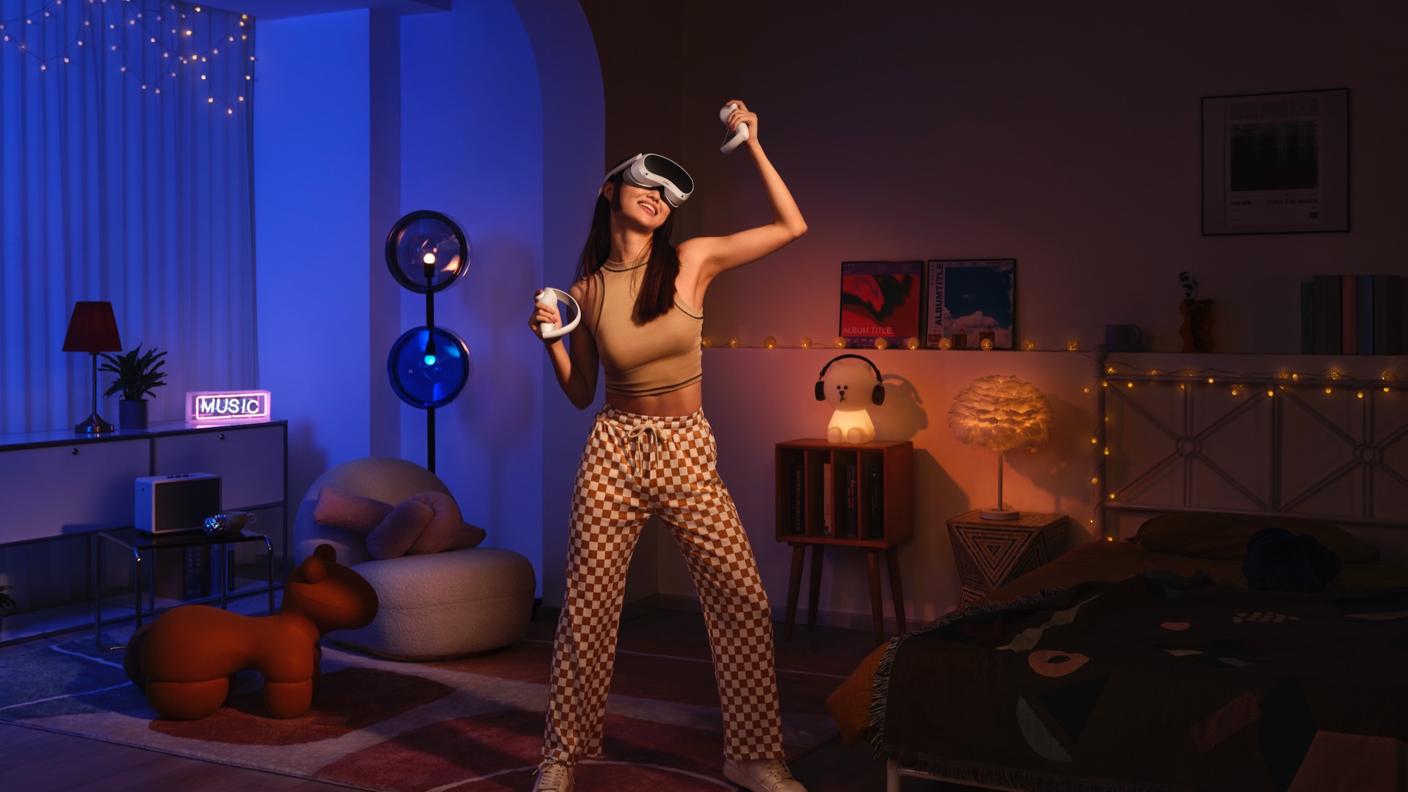 Photo of a woman working out in a living room while wearing the Pico 4 VR headset.