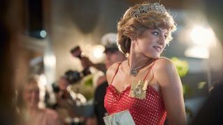 Emma Corrin steps out as Princess Diana in a red dress and tiara in The Crown season 4