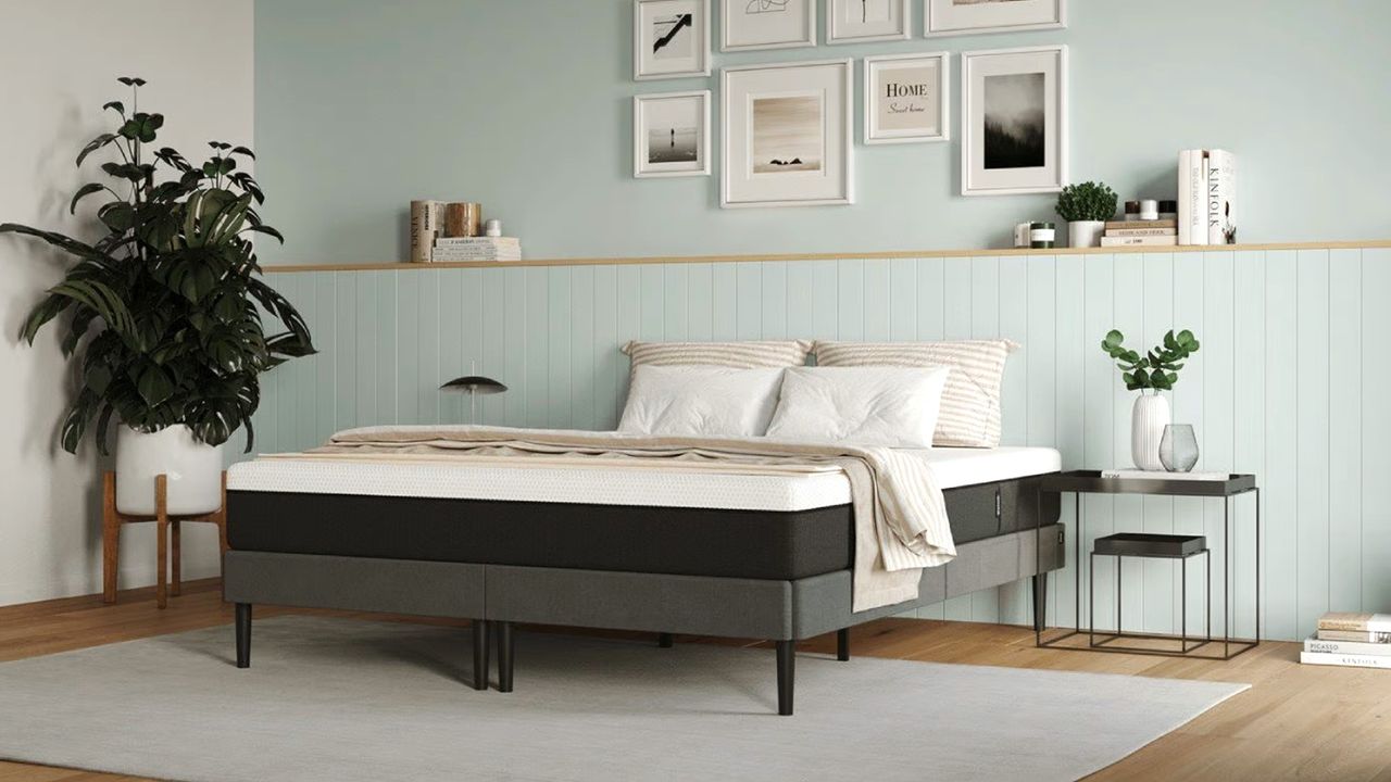 The Emma Original mattress on a bed in a bedroom with pale green walls