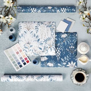 Table with home decorating wall paper and paint samples
