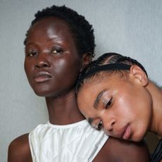 Two models with a subtle, skin-enhancing highlighter