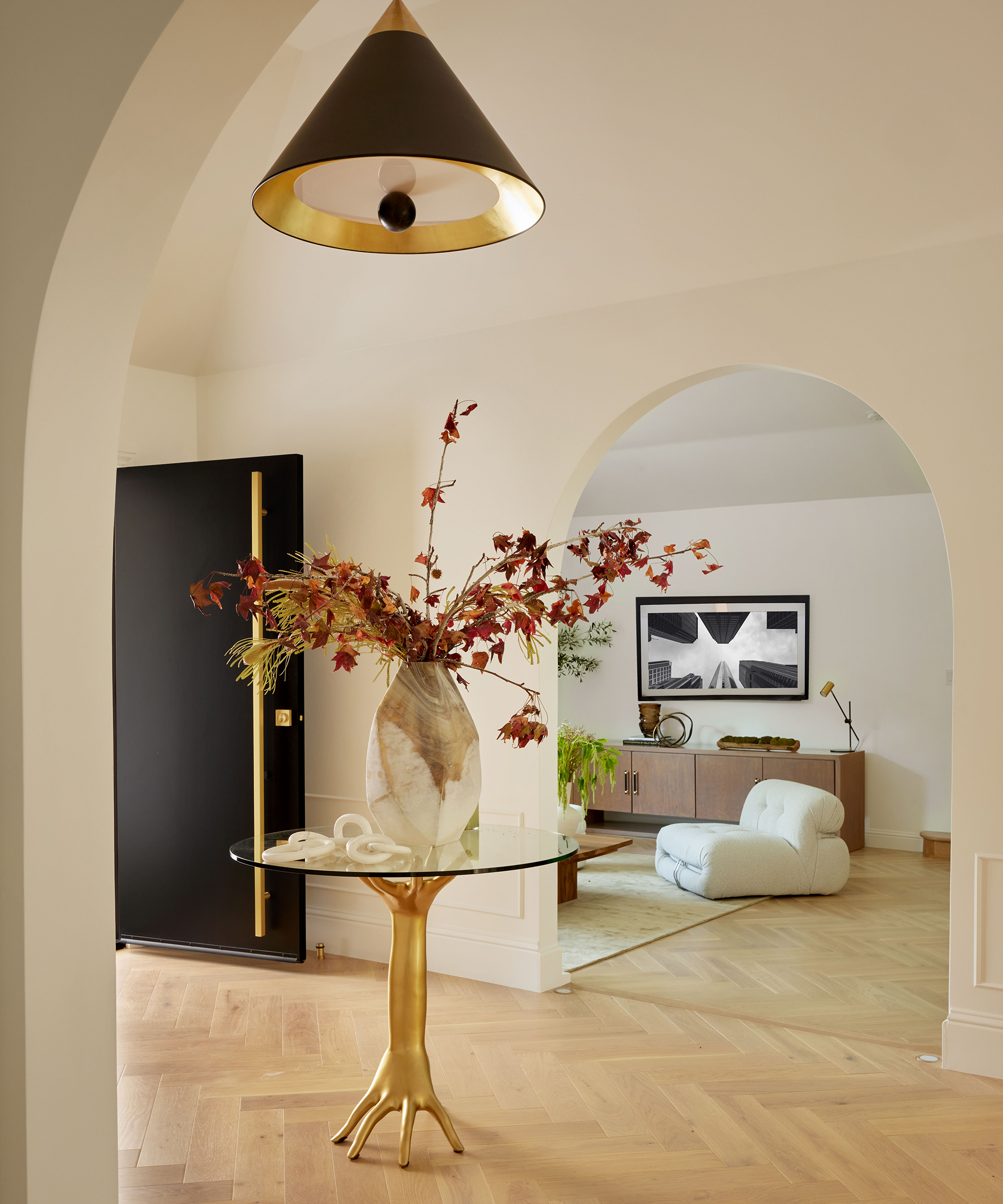 entryway looking through an arched door to a living room