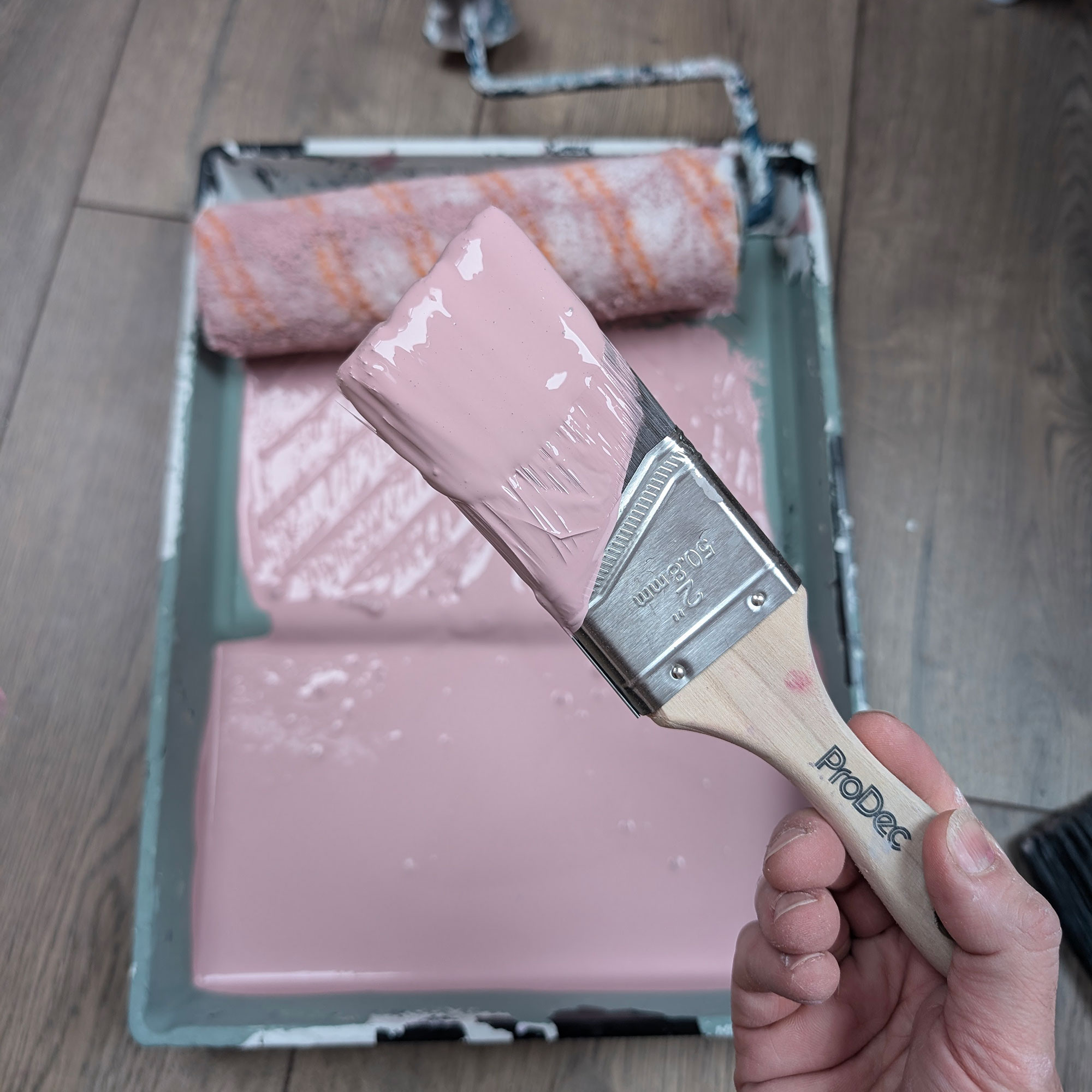 Pink paint in roller tray