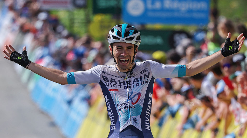 TOPSHOT - Bahrain Victorious's French rider Lenny Martinez celebrates as he crosses the finish line to win the 8th and final stage of the 77th edition of the Criterium du Dauphine cycling race, 133,3 km between Val-d'Arc and Val-Cenis - Plateau du Mont Cenis, on June 15, 2025. (Photo by Anne-Christine POUJOULAT / AFP) (Photo by ANNE-CHRISTINE POUJOULAT/AFP via Getty Images)