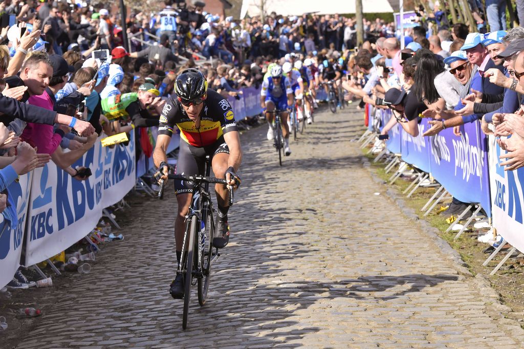 Philippe Gilbert rides away for the victory with teammate Tom Boonen blocking the chase behind