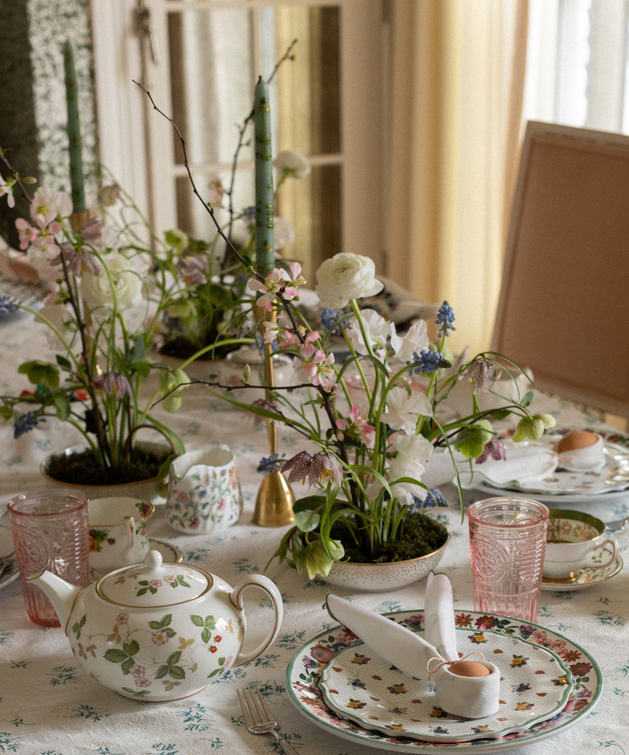 spring table with easter themed napkins and vintage crockery