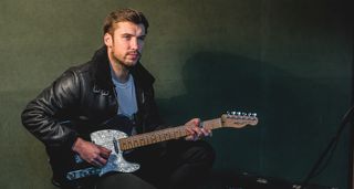 Cash &amp; Carter&#039;s Ross O&#039;Reilly plays a black Telecaster with a pearloid pickguard