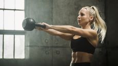 Woman performing a kettlebell swing