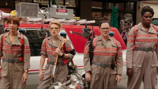 The cast of 2016's Ghostbusters standing in front of Ecto-1 screenshot