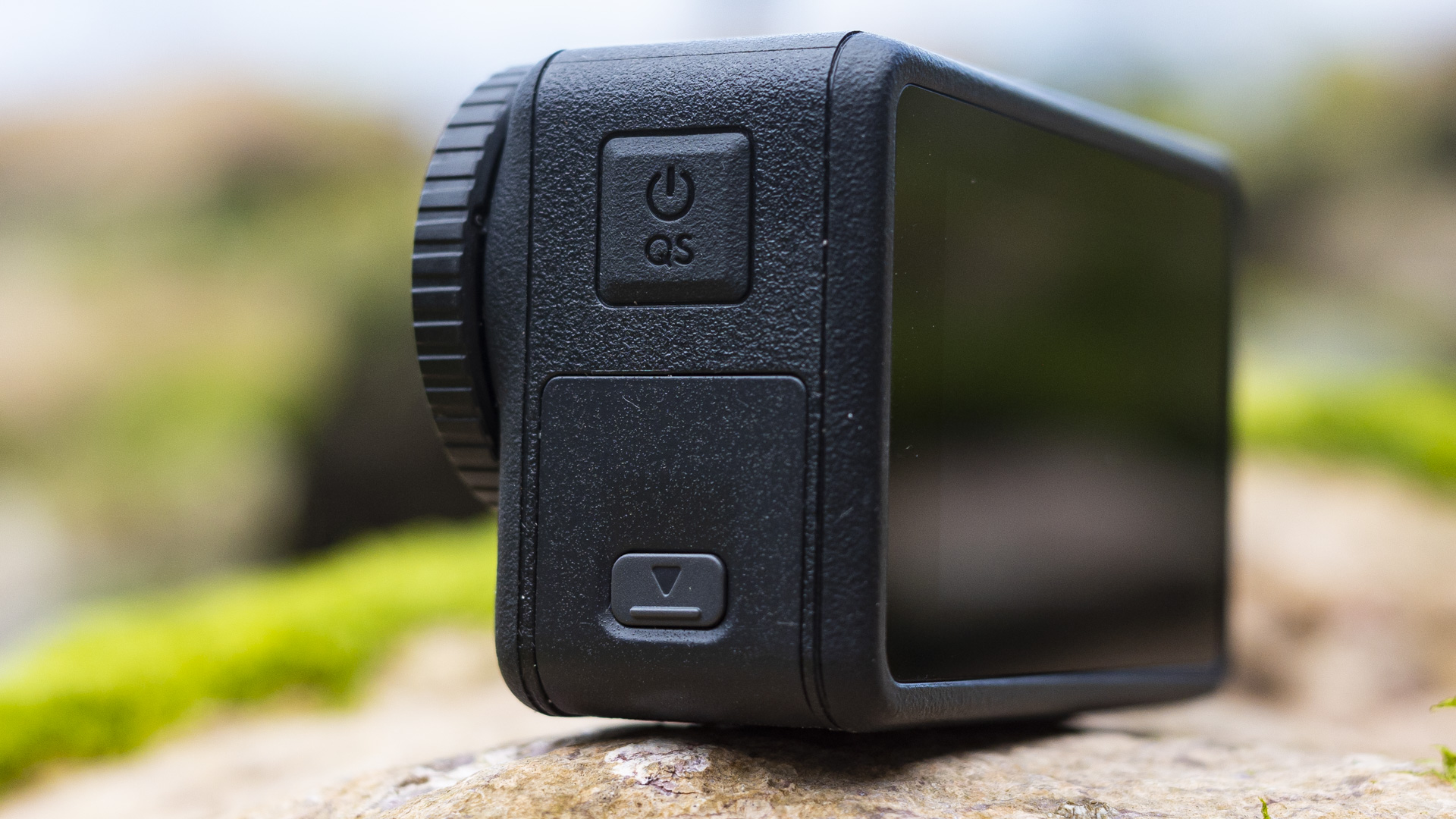 DJI Osmo Action 4 camera left side with on button and USB-C port door