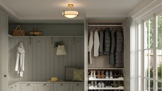 boot room with hanging space, shoe storage and light