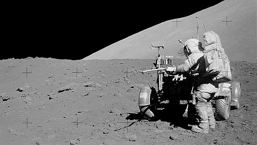 A black and white photo of an astronaut on the moon.