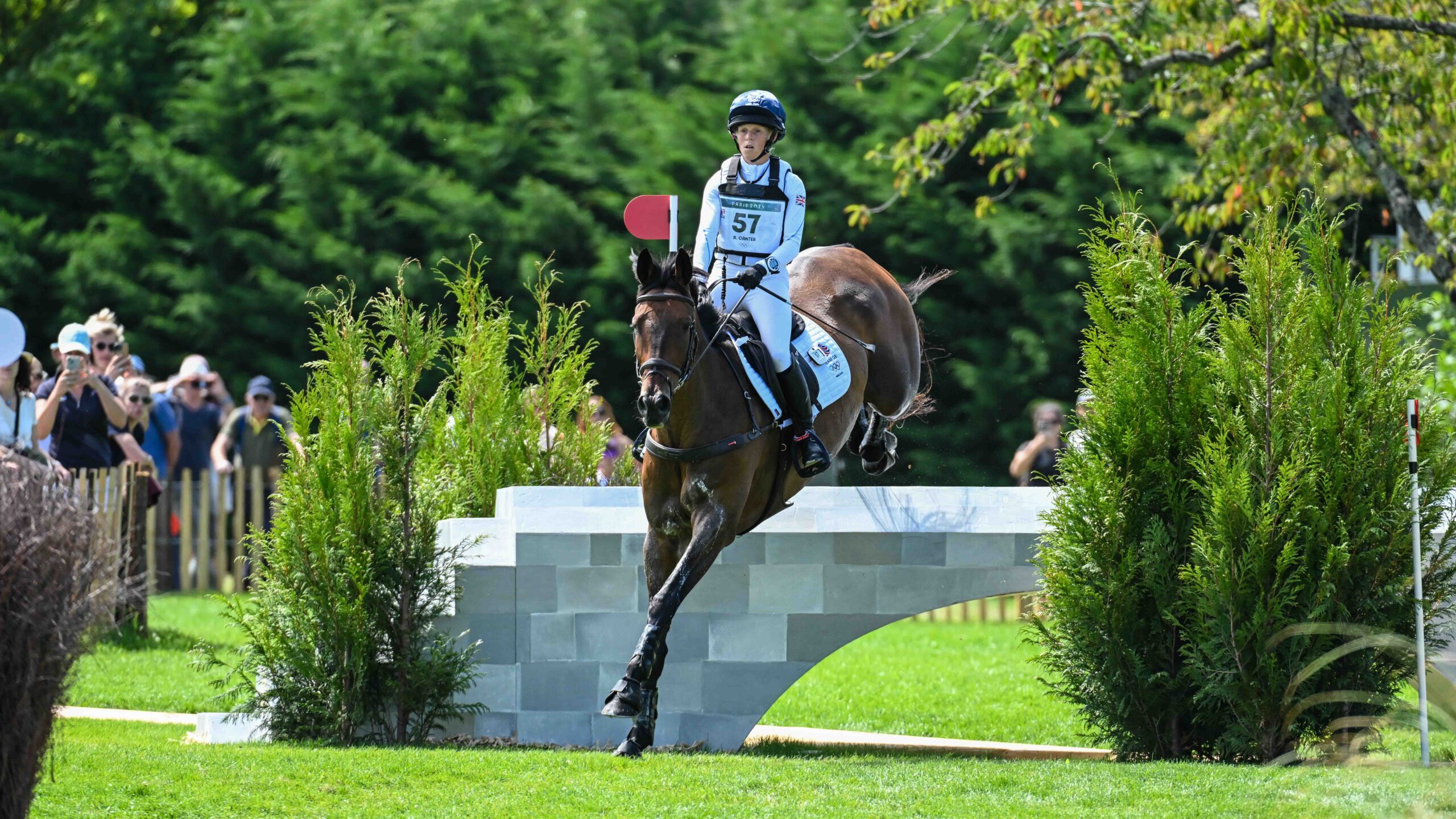 Ros Canter and Lordships Graffalo clear a cross-country jump on the Paris Olympic course on their way to winning team gold.