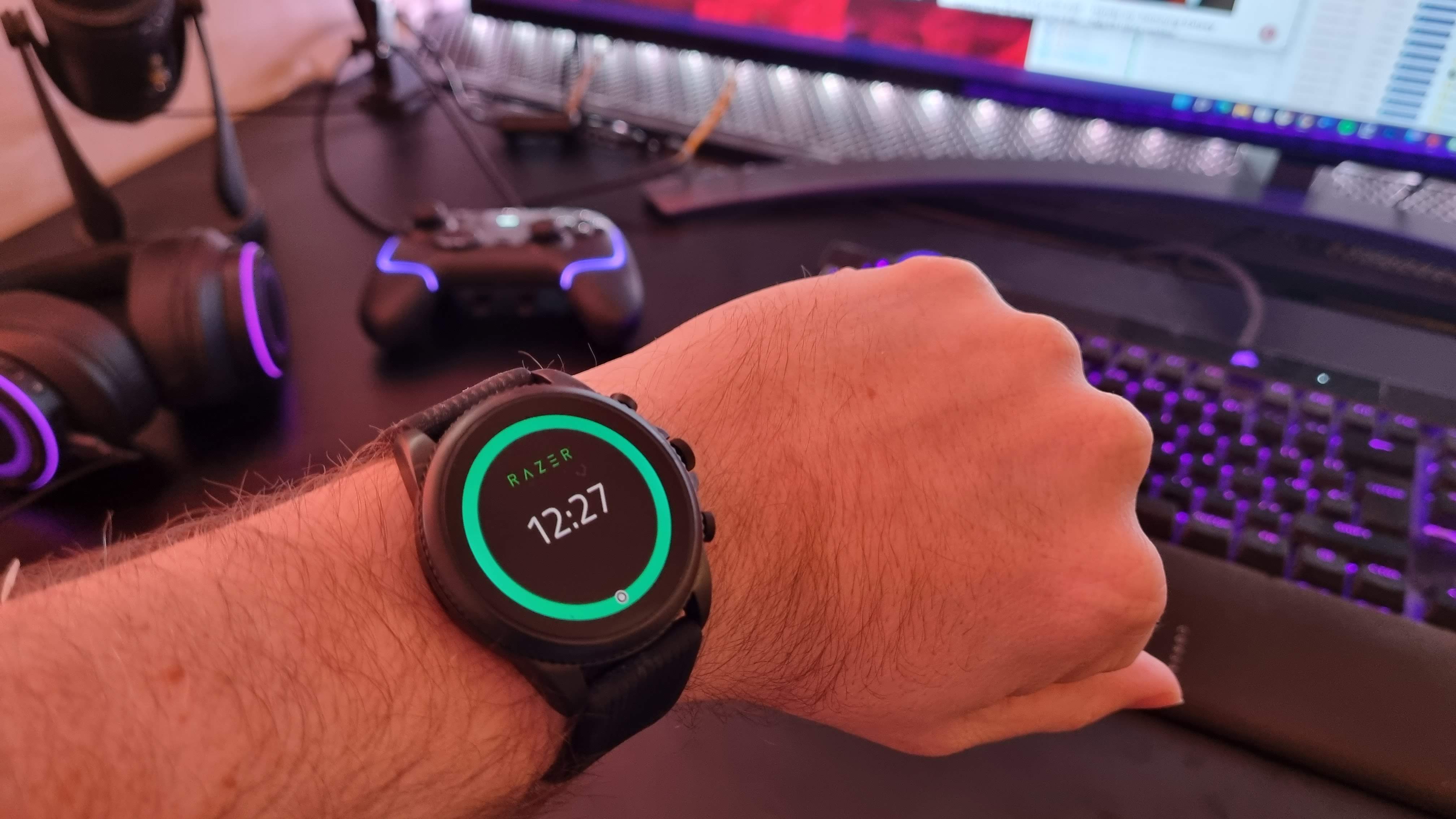 Razer X Fossil Gen 6 smartwatch on a desk with gaming peripherals