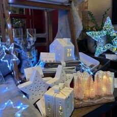 White led houses and presents on a christmas table display