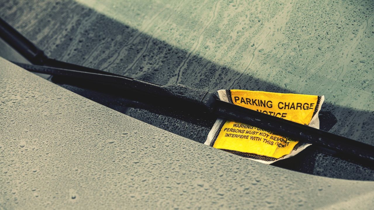 Yellow parking ticket on windscreen