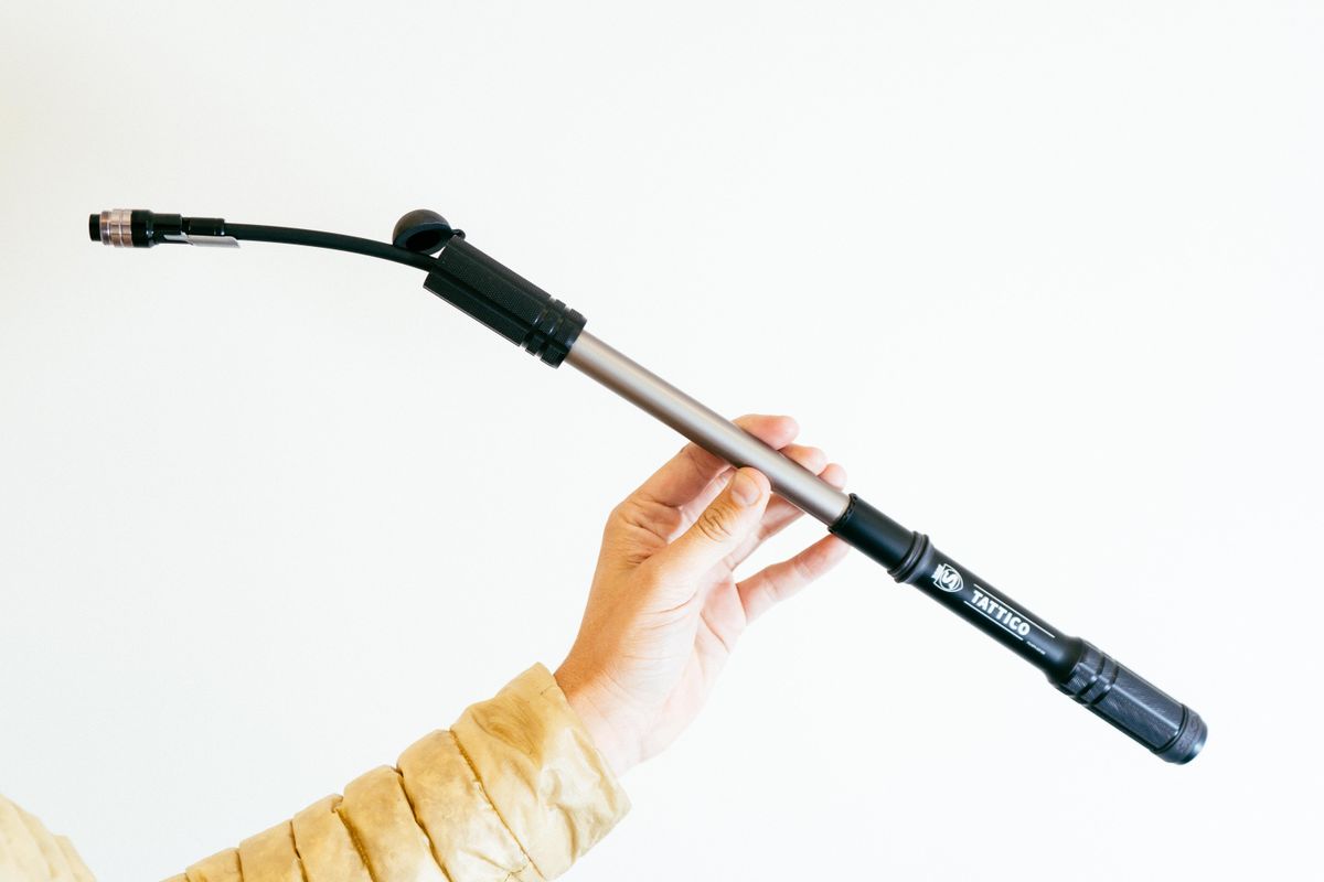 A close up of an extended black bike pump