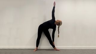 Triangle pose demonstrated by Klaudia Lucia