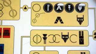 City of Six Moons symbols, laid out in yellow boxes against a white background