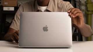 A person using the Apple Incase MacBook hardshell case, one of the best MacBook Air cases 