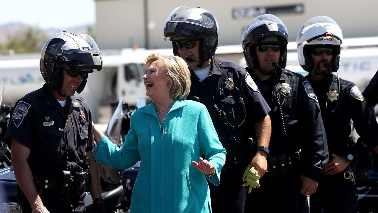 Hillary Clinton jokes with police officers in Reno after giving a speech