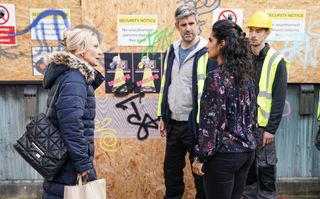 Kathy Beale and Suki Panesar with a group of builders.