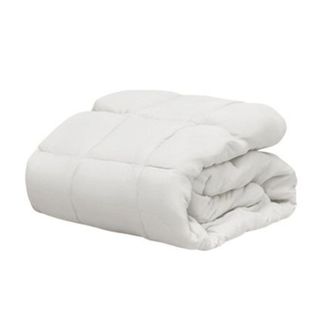 A white folded over Saatva duvet comforter