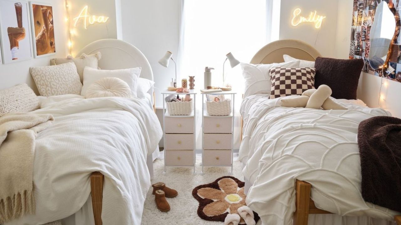 Dorm with two white beds and neon white signs