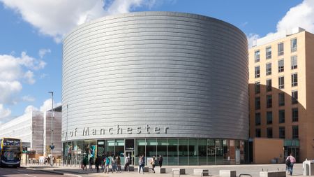The large, drum-shaped building of The University of Manchester, University Place, Oxford Road, Manchester.