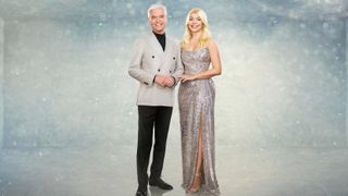 Philip Schofield and Holly Willoughby waring sparkly outfits and standing in front of an icy background for Dancing on Ice 2023