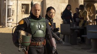 Boba Fett and Fennec Shand walk the Tatooine streets in The Book of Boba Fett episode 1