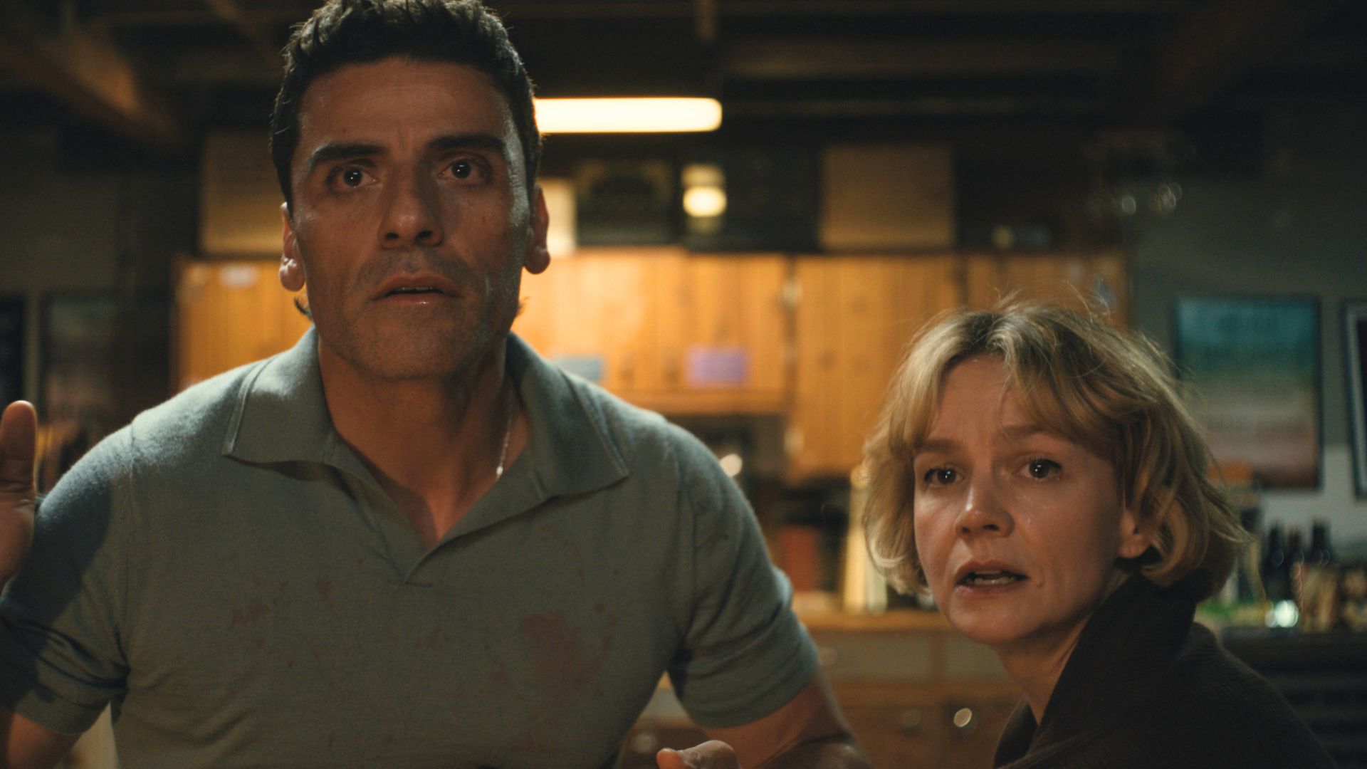 Josh and Lindsay look horrified out of a window