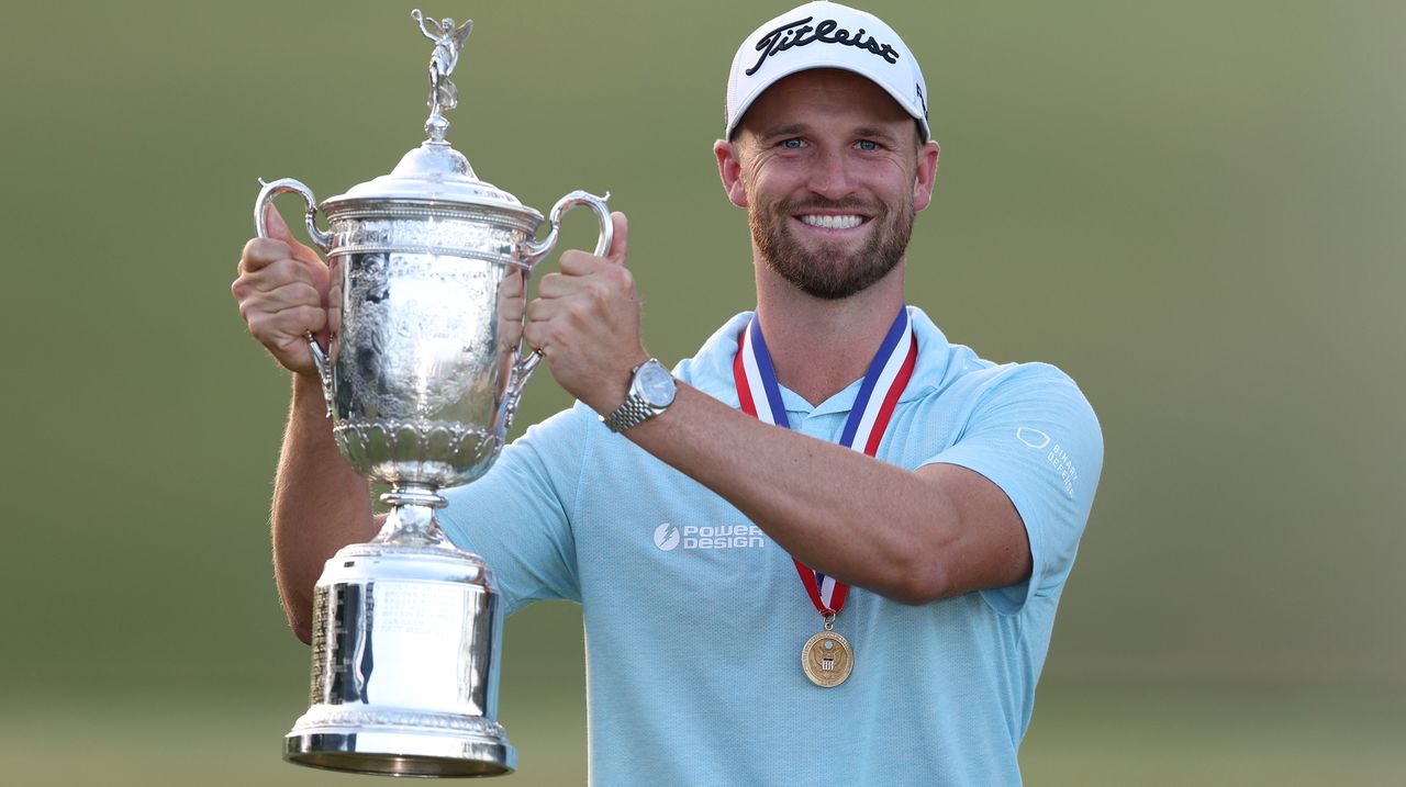 Wyndham Clark lifts the US Open trophy