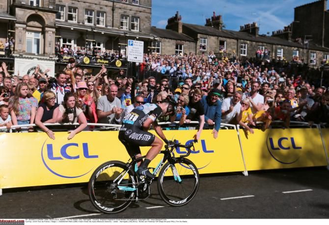 Mark Cavendish rides off after crashing in the finale