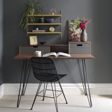 home office room with grey walls and wooden table 