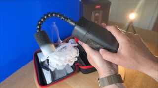 A flexible plastic pipe directs the fog downwards. A foam diffuser at the end of the pipe creates dry ice style fog