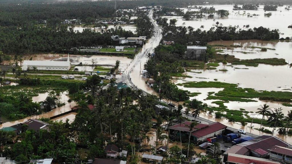 Houses in Leyte province are underwater, following flooding caused by tropical storm Megi.