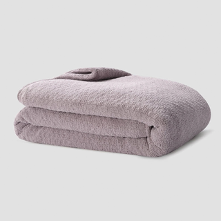 A lavender knit weighted blanket