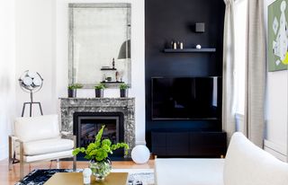 Black and white living room with a marble fireplace