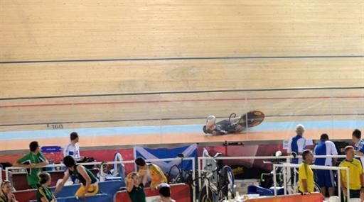 Officials watch Sam Michael Webster (New Zealand) crash and injure himself during the men's team sprint.