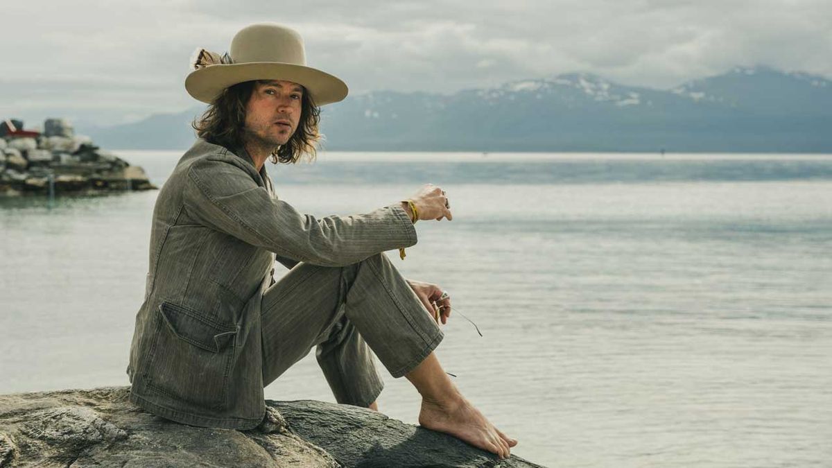 Jay Buchanan sitting by a lake