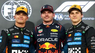 McLaren's Lando Norris and Oscar Piastri flanking Red Bull's Max Verstappen at the Abu Dhabi Grand Prix